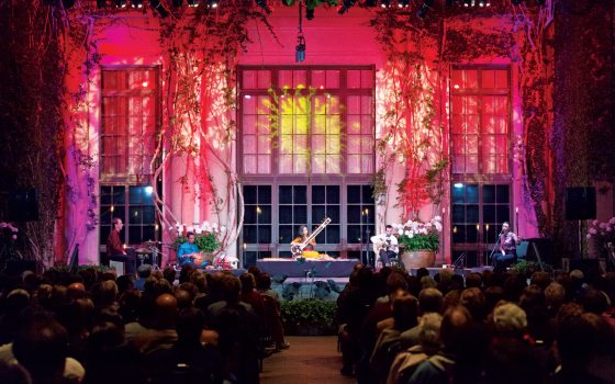 a concert with red and purple lights 