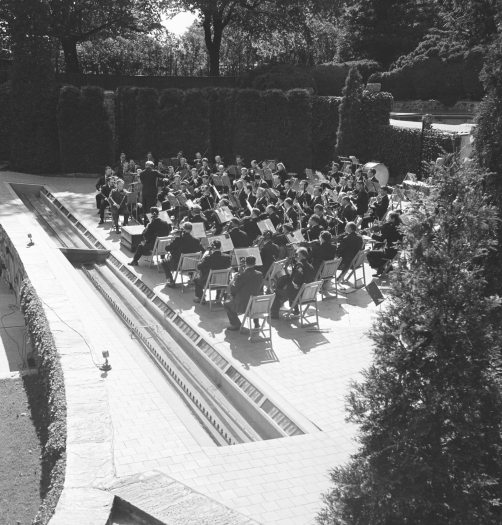 An orchestra performs on stage