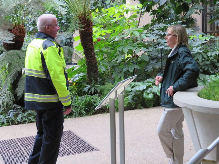 two people talking in a conservatory