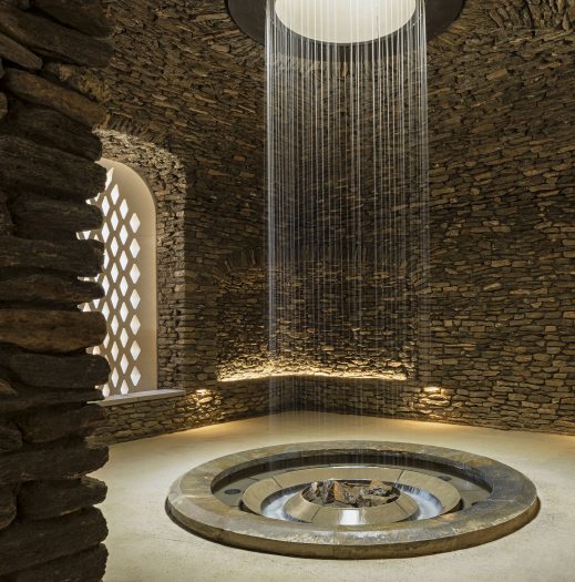 indoor daytime image of water cascading in the grotto