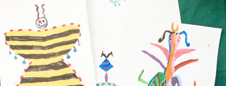 a colorful child's drawing of a butterfly and other bugs