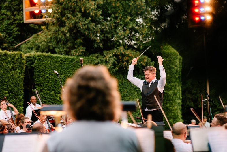 a conductor on stage