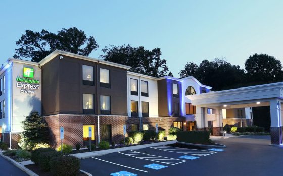 image of brown and white hotel at dusk