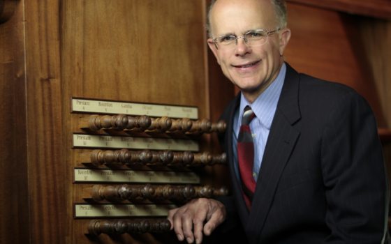 a person sitting on an organ 