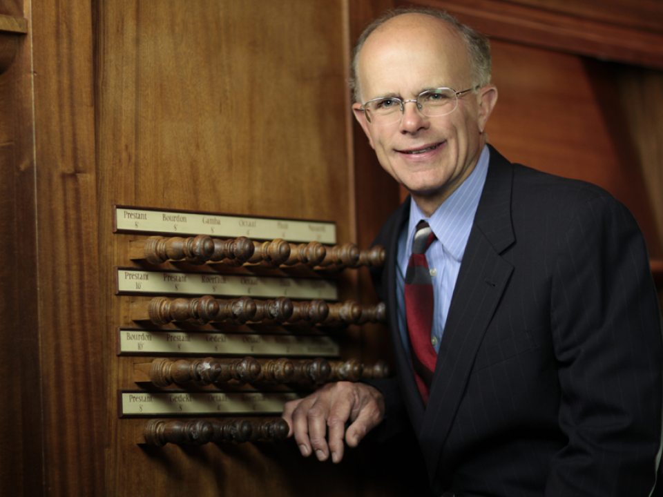 a person sitting on an organ 